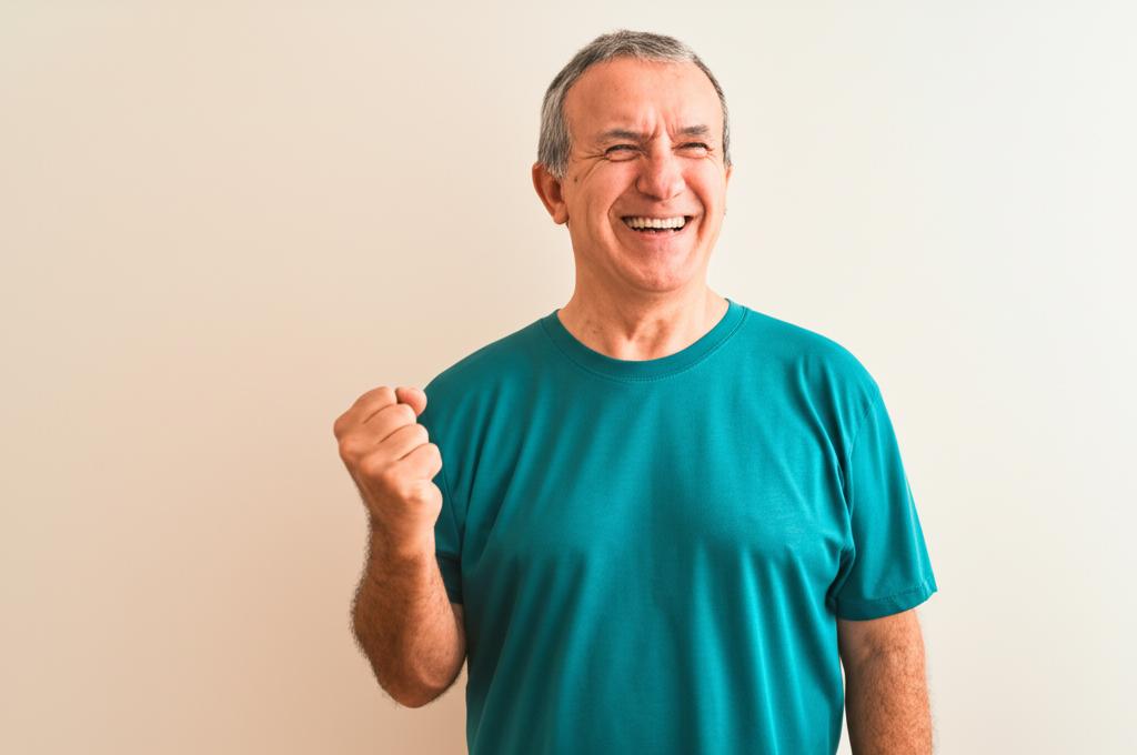 Happy middle-aged man full of energy, smiling and active