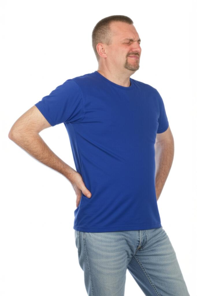 man feeling tired and rubbing lower back